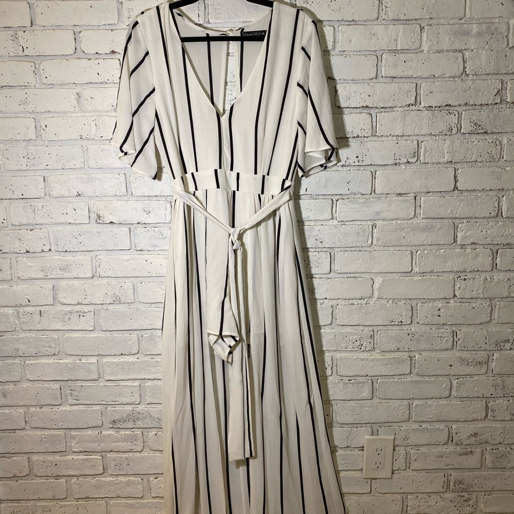Unique short, jumpsuit with long skirt.